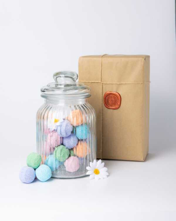 Indulge in a luxurious and soothing bath experience with our mixed-scented mini bath bomb chill pills, now available in a glass jar. Our bath bombs are crafted with a unique blend of natural ingredients that work together to moisturize and nourish your skin, leaving it feeling soft and supple.