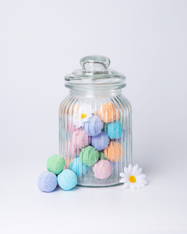 Indulge in a luxurious and soothing bath experience with our mixed-scented mini bath bomb chill pills, now available in a glass jar. Our bath bombs are crafted with a unique blend of natural ingredients that work together to moisturize and nourish your skin, leaving it feeling soft and supple.