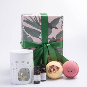 The Botanical Bath Essentials Gift Set is the perfect present for anyone looking to indulge in a luxurious spa-like experience in the comfort of their own home. The set includes two Rose essential oils, an oil burner, bath salts, and two beautifully scented bath bombs - one rhubarb and rose bath bomb, and one sweet rose bath bomb.