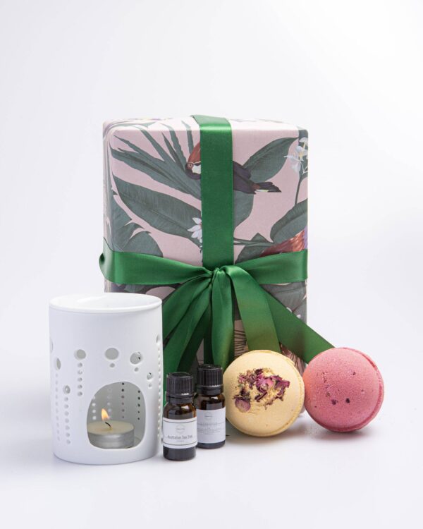 The Botanical Bath Essentials Gift Set is the perfect present for anyone looking to indulge in a luxurious spa-like experience in the comfort of their own home. The set includes two Rose essential oils, an oil burner, bath salts, and two beautifully scented bath bombs - one rhubarb and rose bath bomb, and one sweet rose bath bomb.
