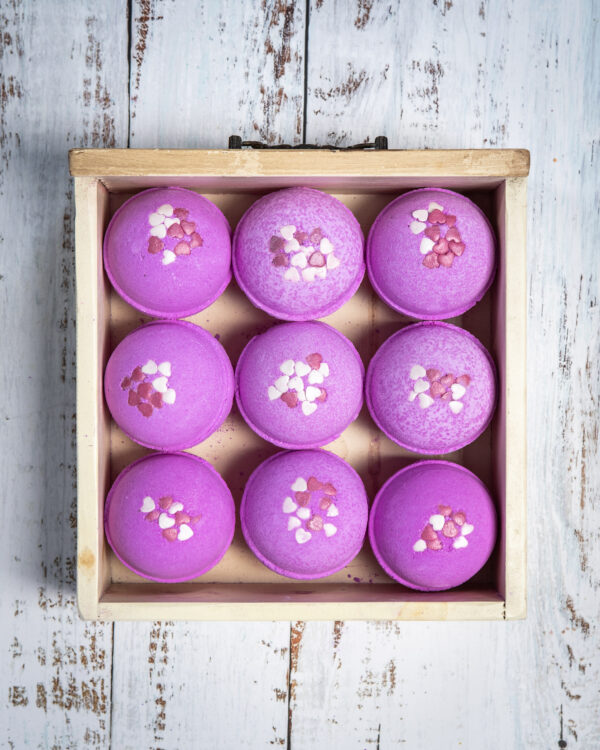 Our Blissful Berry Bath Bomb is optimal for self-love and care, adding a delightful pink hue to your bath and extra love with some heart-shaped confetti for that something special.